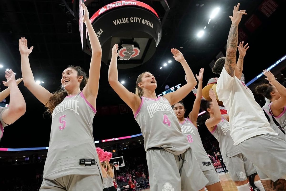 Feb 1, 2024; Columbus, OH, USA; Ohio State Buckeyes guard Emma Shumate (5) and guard Jacy Sheldon (4) sing    Carmen Ohio    following their 87-49 win over the Wisconsin Badgers in the NCAA women   s basketball game at Value City Arena.