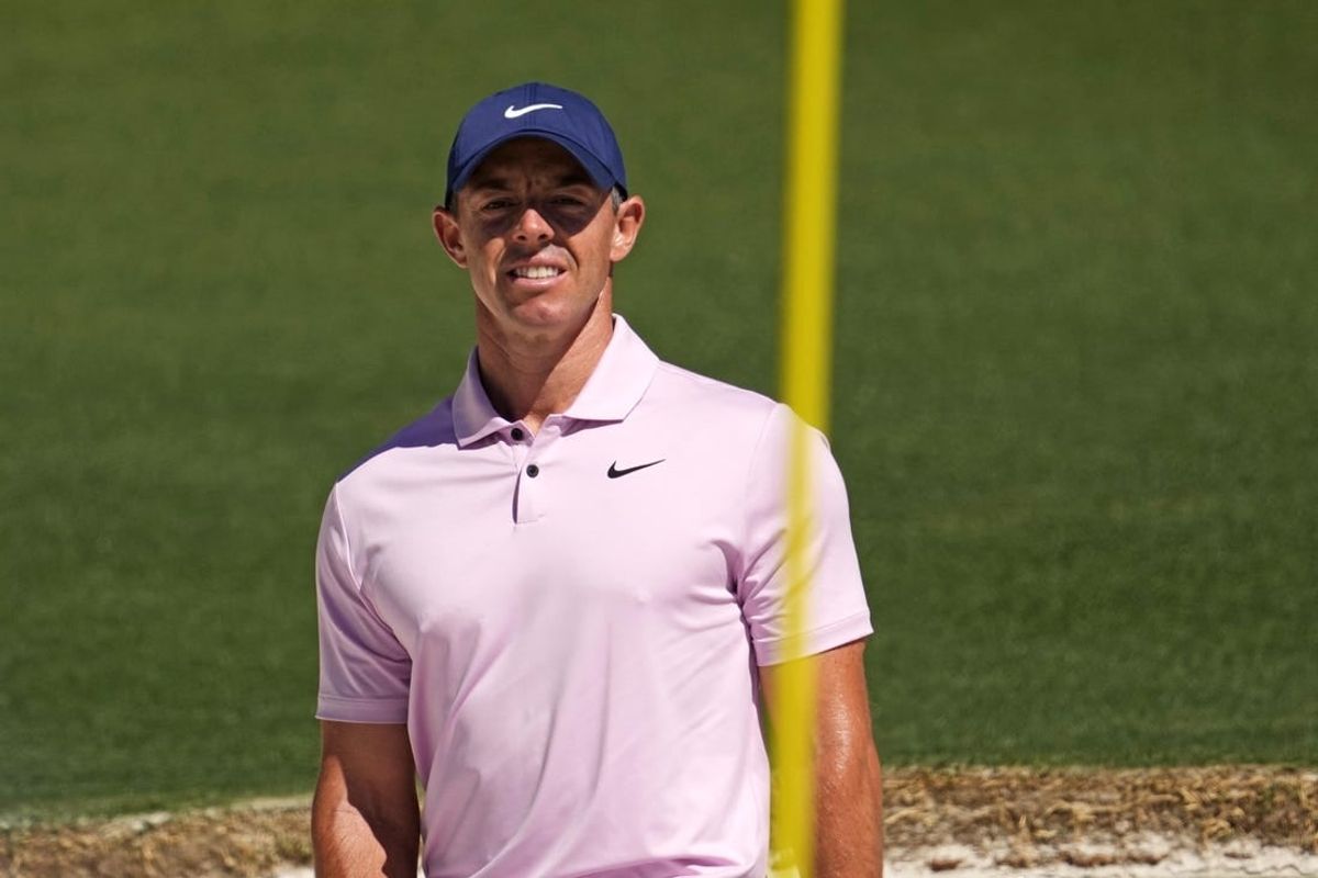Apr 13, 2024; Augusta, Georgia, USA; Rory McIlroy reacts to his shot on the second hole during the third round of the Masters Tournament.
