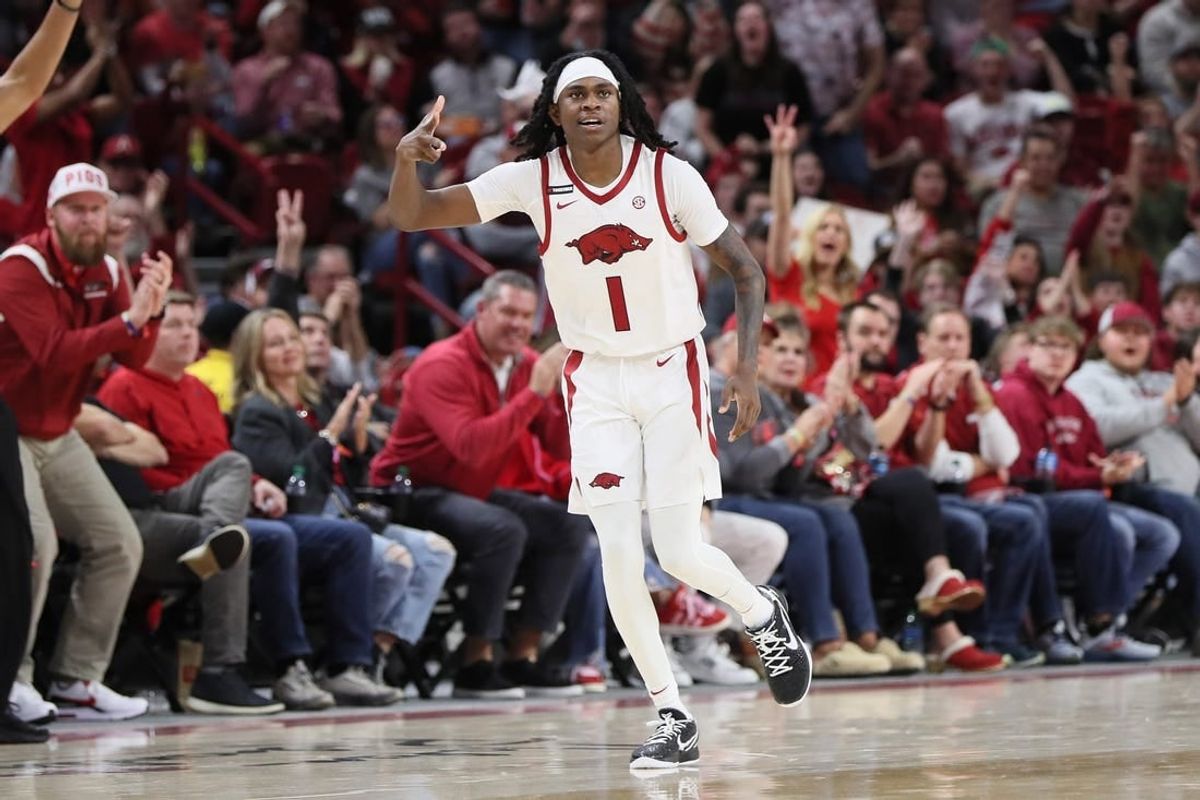 Dec 30, 2023; Fayetteville, Arkansas, USA; Arkansas Razorbacks guard Keyon Menifield Jr (1) celebrates after making a three point shot in the first half against the UNC Wilmington Seahawks at Bud Walton Arena.