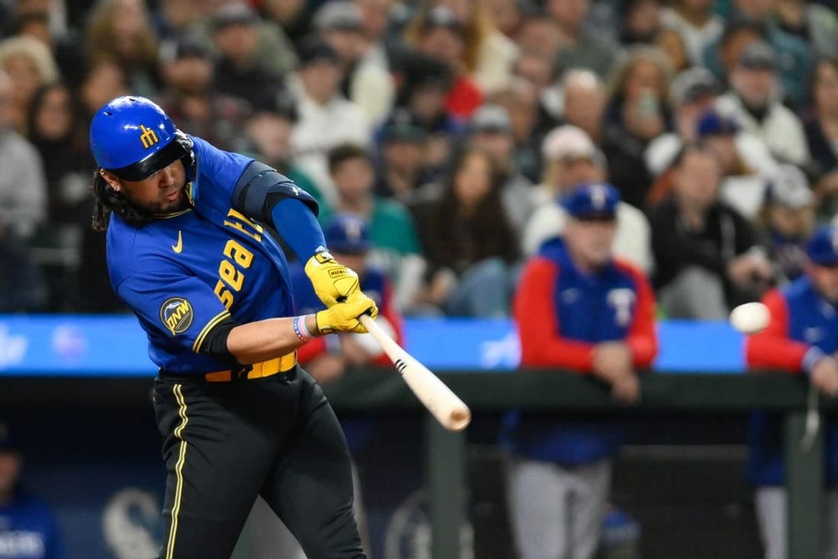 Sep 29, 2023; Seattle, Washington, USA; Seattle Mariners third baseman Eugenio Suarez (28) hits an RBI double against the Texas Rangers during the third inning at T-Mobile Park.