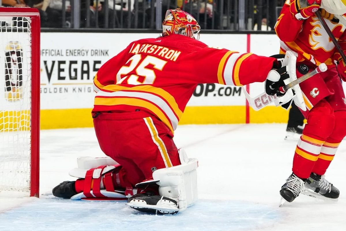 Jan 13, 2024; Las Vegas, Nevada, USA; Calgary Flames goaltender Jacob Markstrom (25) blocks a shot by the Vegas Golden Knights during the second period at T-Mobile Arena.