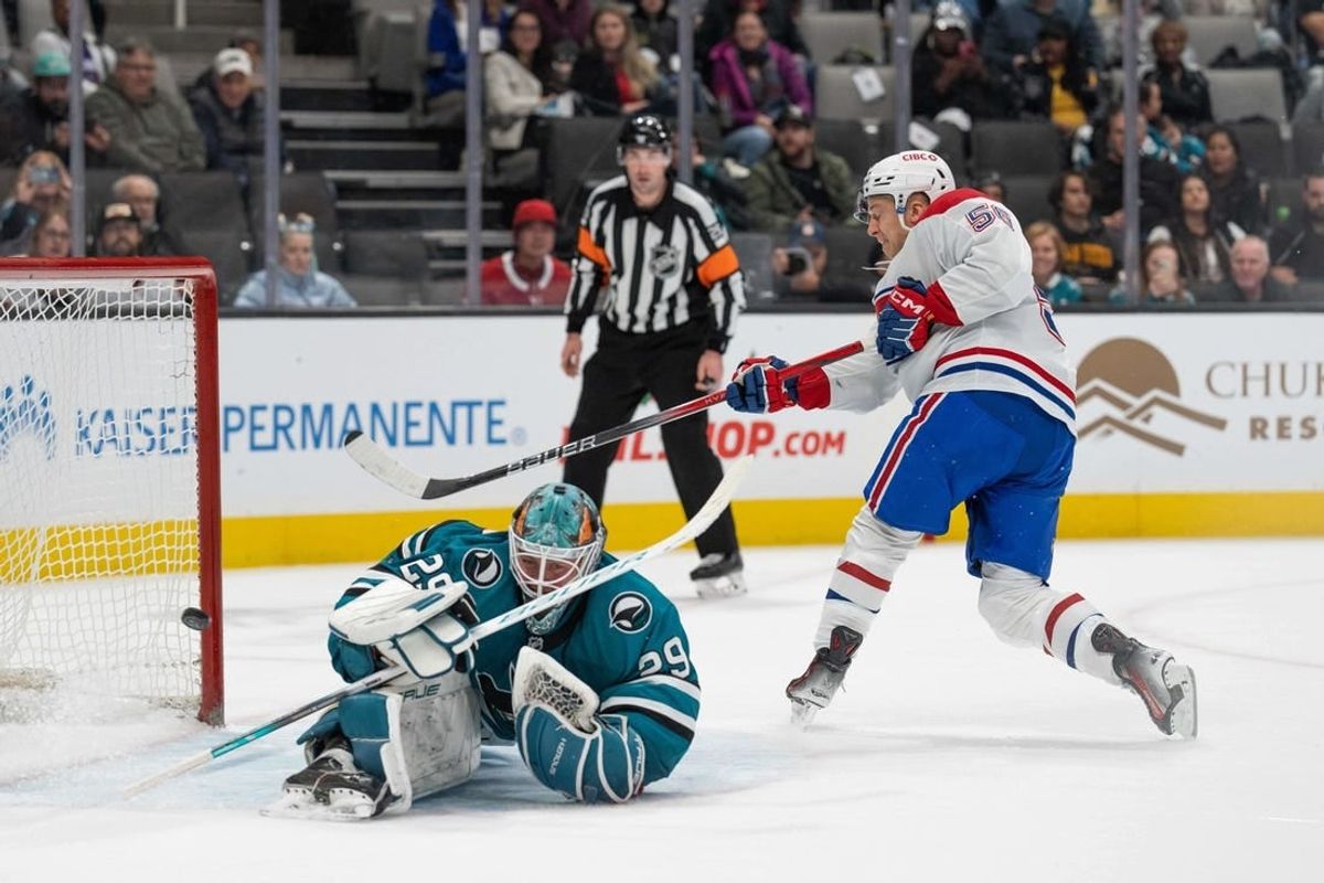 Nov 24, 2023; San Jose, California, USA; Montreal Canadiens right wing Jesse Ylonen (56) shoots the winning goal during the shootout against San Jose Sharks goaltender Mackenzie Blackwood (29) at SAP Center at San Jose.