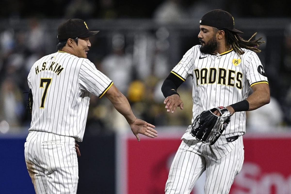 Apr 8, 2024; San Diego, California, USA; San Diego Padres right fielder Fernando Tatis Jr. (right) and shortstop Ha-Seong Kim (7) celebrate after defeating the Chicago Cubs at Petco Park.