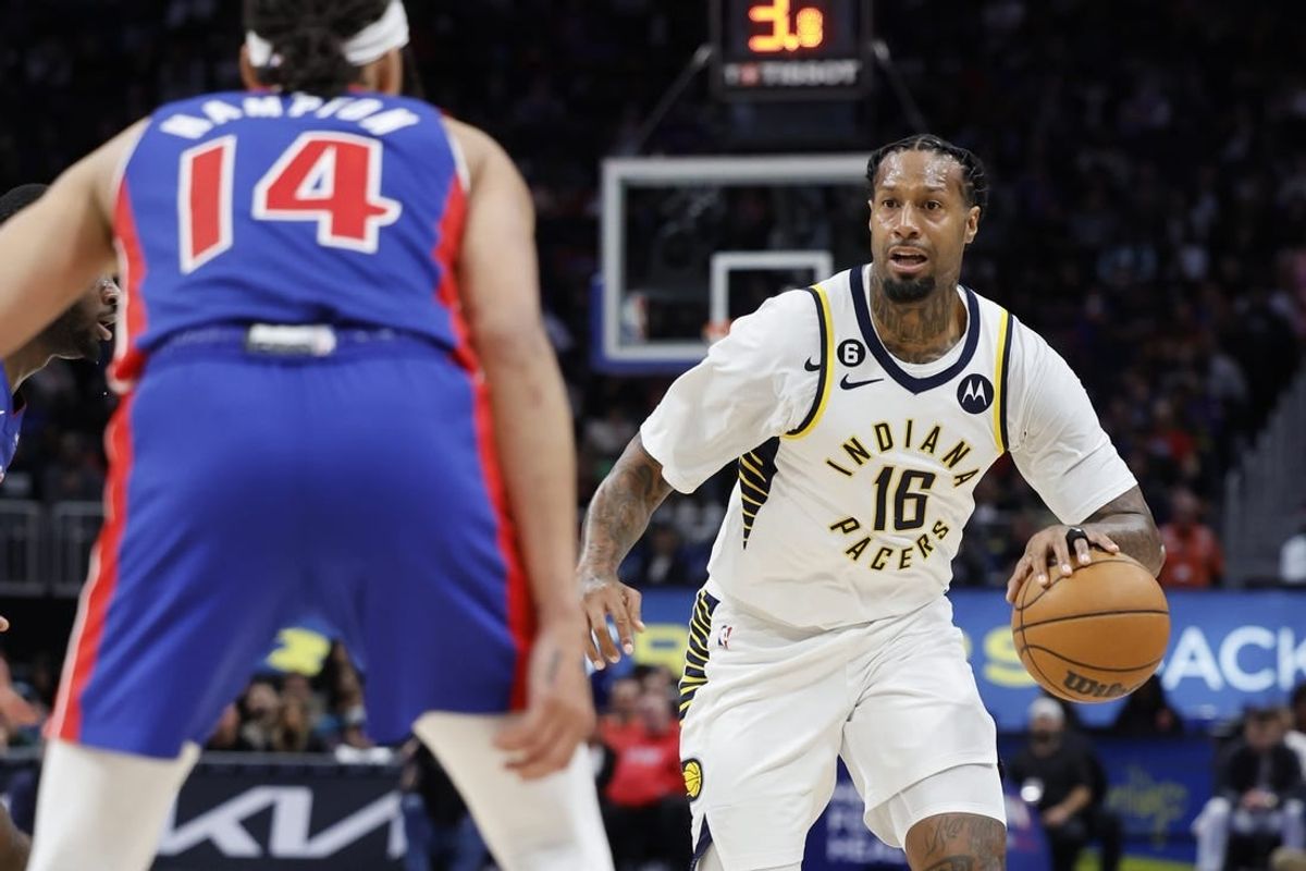 Mar 11, 2023; Detroit, Michigan, USA;  Indiana Pacers forward James Johnson (16) dribbles the ball against Detroit Pistons guard R.J. Hampton (14) in the second half at Little Caesars Arena.
