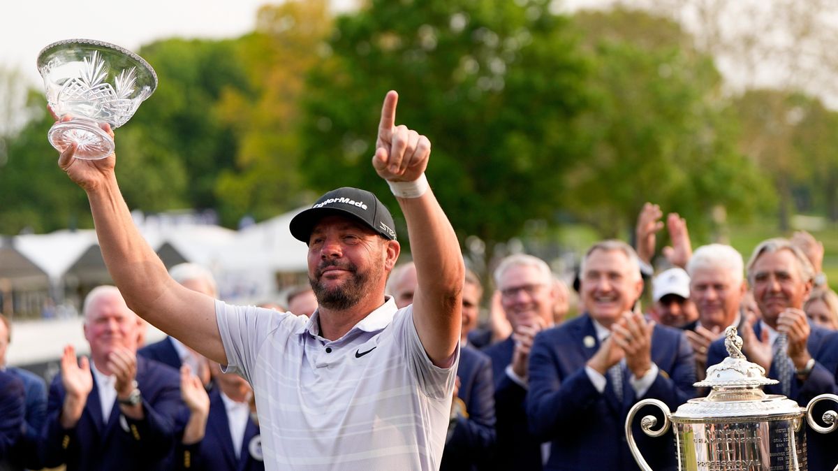 Michael Block poses with the crystal bowl he won for being the low club professional at the PGA Championship golf tournament at Oak Hill Country Club.