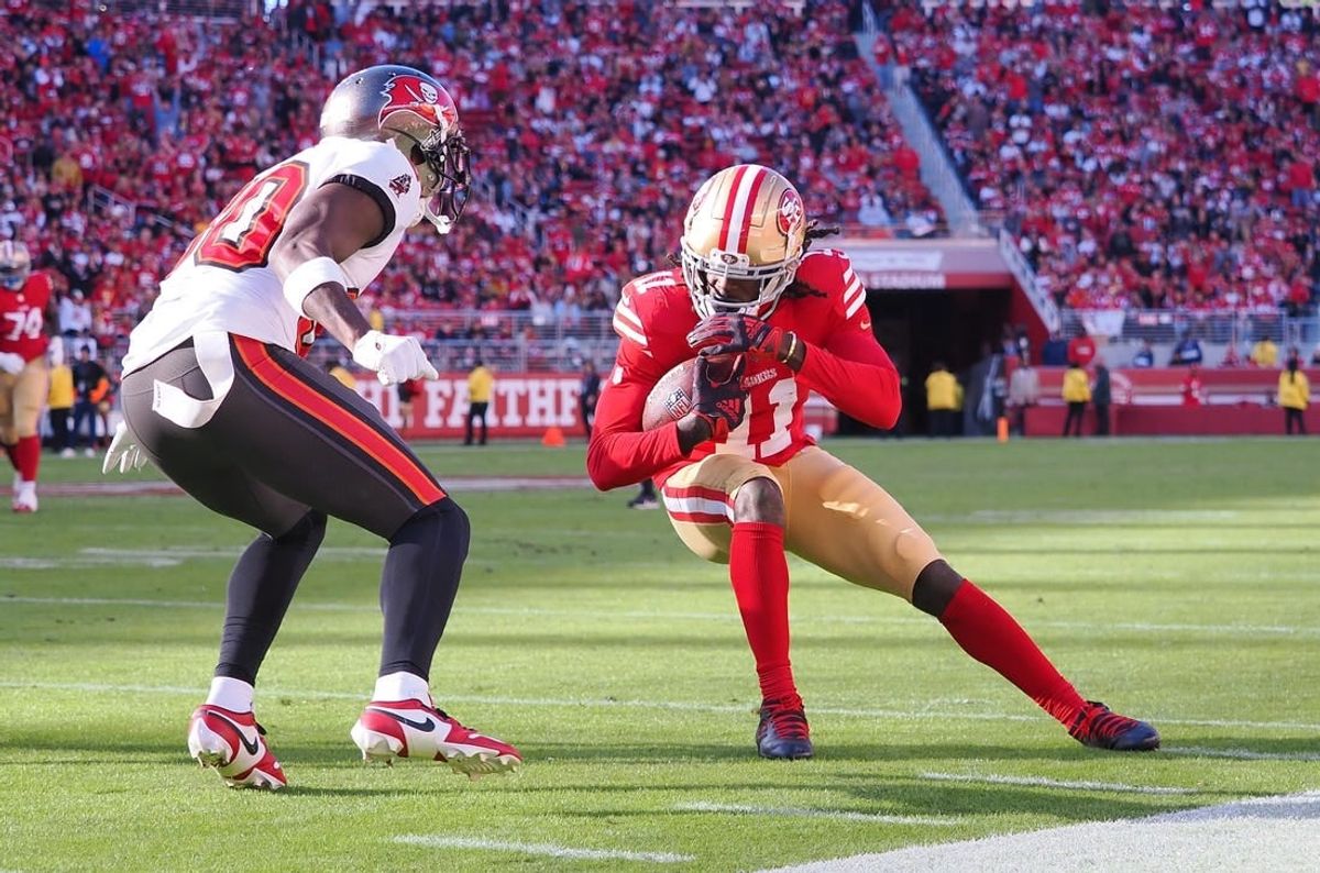 Nov 19, 2023; Santa Clara, California, USA; San Francisco 49ers wide receiver Brandon Aiyuk (11) leans into the play against Tampa Bay Buccaneers defensive back Dee Delaney (30) during the second quarter at Levi's Stadium.