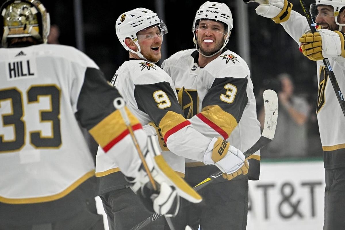 Nov 22, 2023; Dallas, Texas, USA; Vegas Golden Knights center Jack Eichel (9) and defenseman Brayden McNabb (3) and goaltender Adin Hill (33) celebrate after Eichel scores the game winning goal against the Dallas Stars during the overtime period at the American Airlines Center.