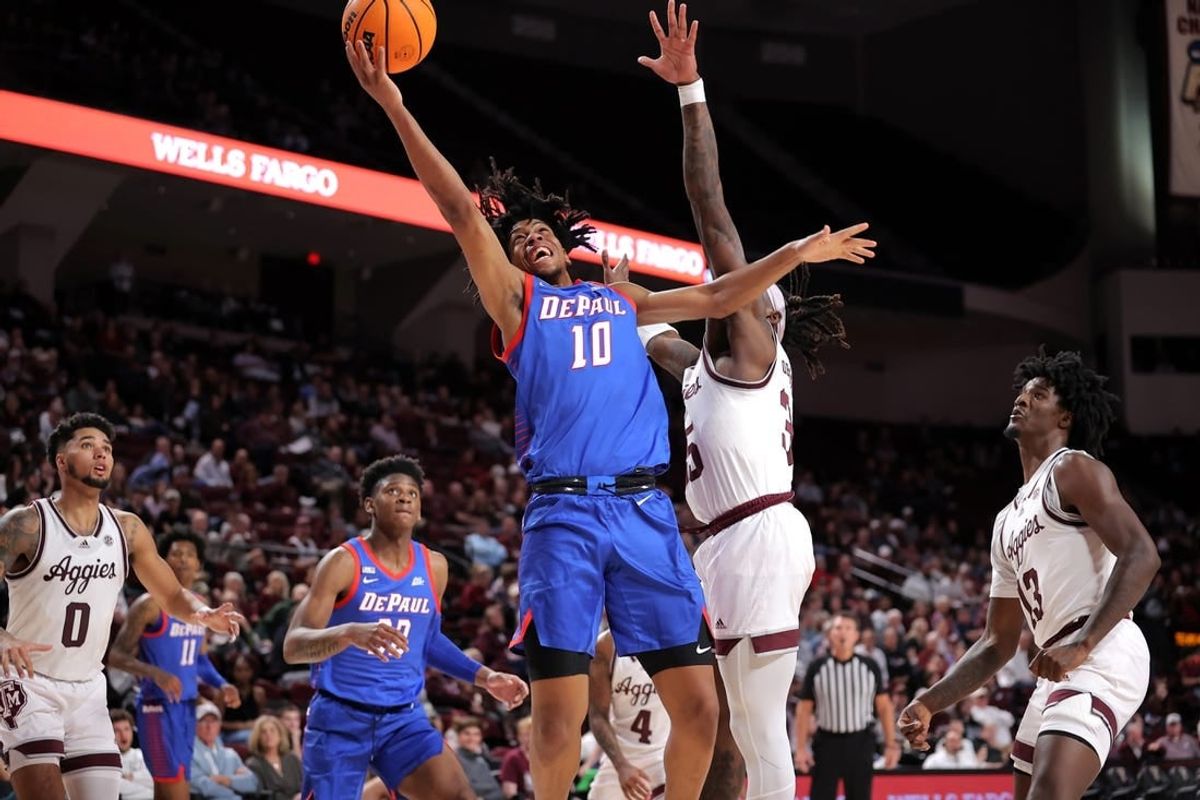 Dec 6, 2023; College Station, Texas, USA; DePaul Blue Demons guard Jaden Henley (10) attempts a layup against the Texas A&M Aggies during the second half at Reed Arena.