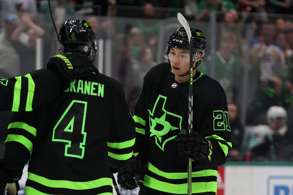Apr 13, 2024; Dallas, Texas, USA; Dallas Stars left wing Jason Robertson (21) and defenseman Miro Heiskanen (4) celebrate a power play goal against the Seattle Kraken in the second period at American Airlines Center.