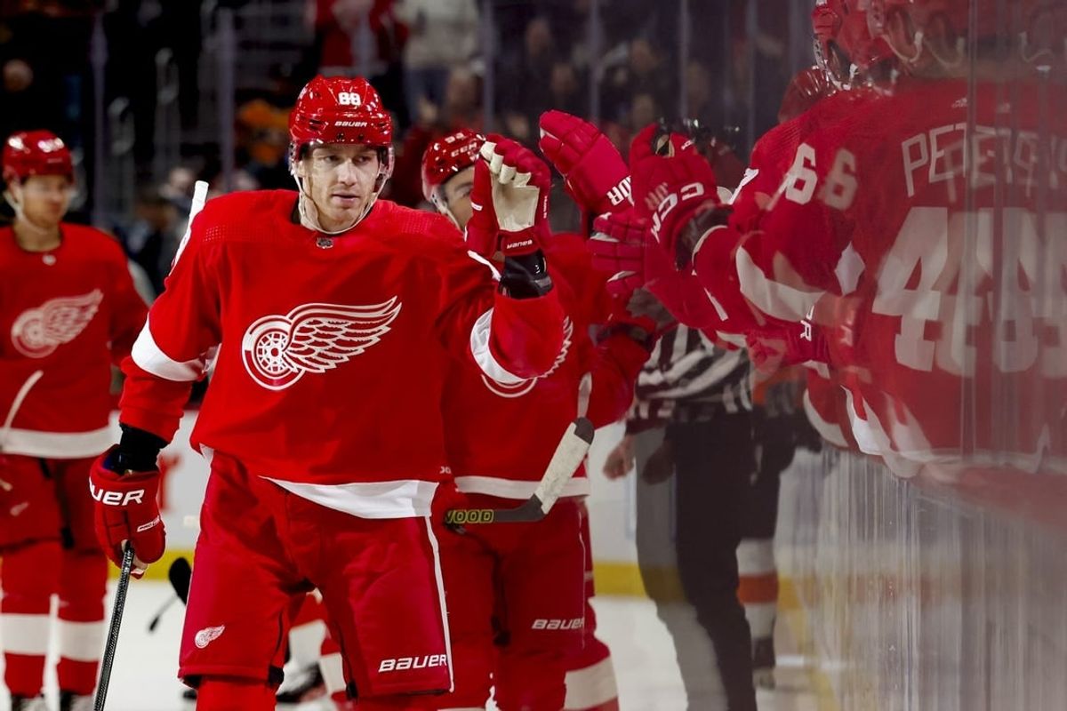 Dec 22, 2023; Detroit, Michigan, USA;  Detroit Red Wings right wing Patrick Kane (88) receives congratulations from teammates after scoring in the first period against the Philadelphia Flyers at Little Caesars Arena.