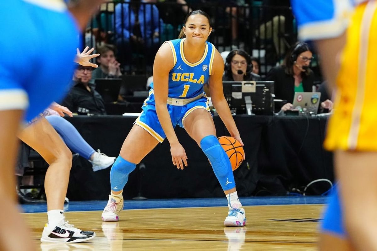 Mar 8, 2024; Las Vegas, NV, USA; UCLA Bruins guard Kiki Rice (1) dribbles against the USC Trojans during the first quarter at MGM Grand Garden Arena.