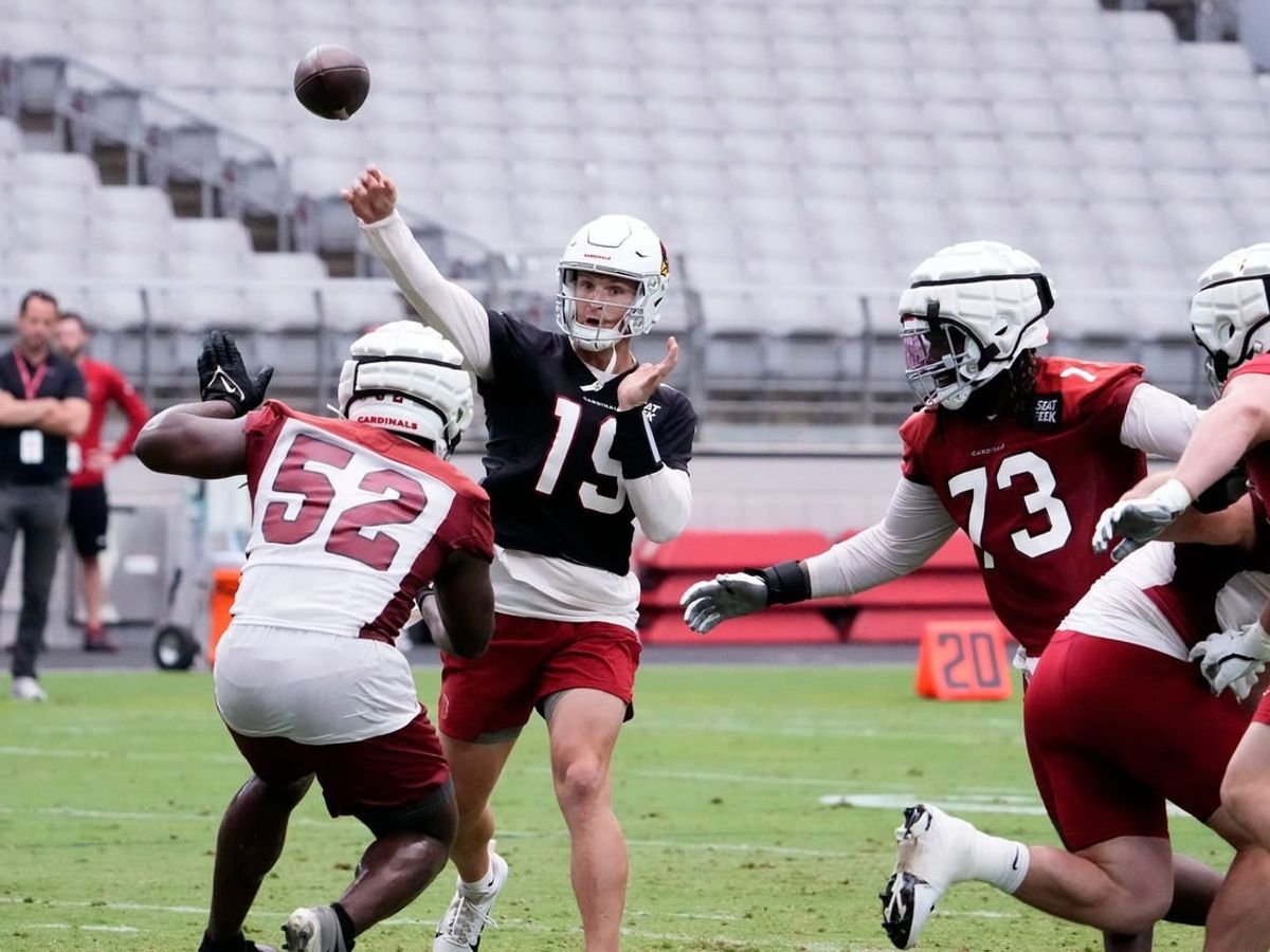 Jul 27, 2023; Phoenix, AZ, USA; Arizona Cardinals quarterback Jeff Driskel (19) throws a pass over Arizona Cardinals linebacker Victor Dimukeje (52) during training camp at State Farm Stadium.