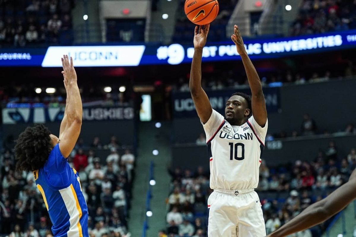 Jan 28, 2024; Hartford, Connecticut, USA; UConn Huskies guard Hassan Diarra (10) shoots for three points against the Xavier Musketeers in the second half at XL Center.