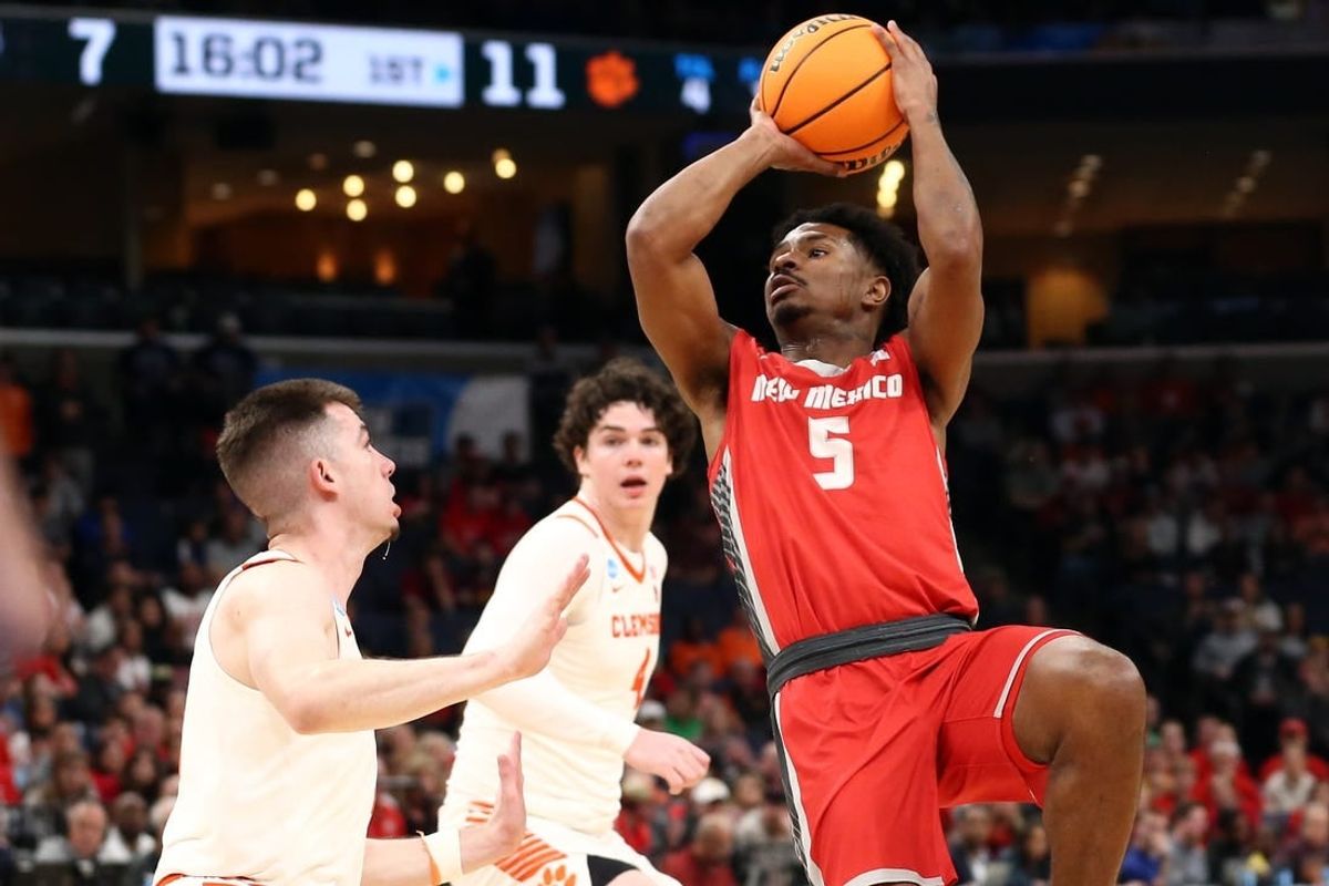 Mar 22, 2024; Memphis, TN, USA; New Mexico Lobos guard Jamal Mashburn Jr. (5) shoots during the first half against the Clemson Tigers in the NCAA Tournament First Round at FedExForum.