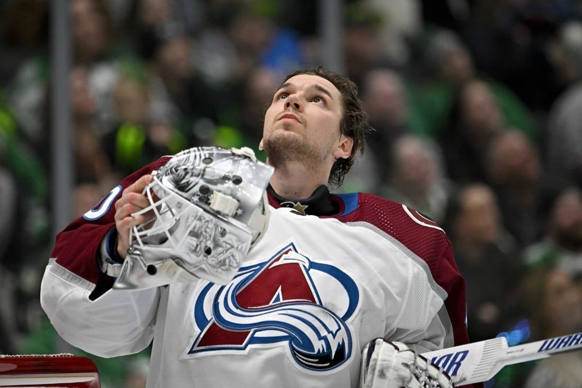 Jan 4, 2024; Dallas, Texas, USA; Colorado Avalanche goaltender Alexandar Georgiev (40) looks up as he puts his helmet back on during a stoppage in play against the Dallas Stars during the second period at the American Airlines Center.