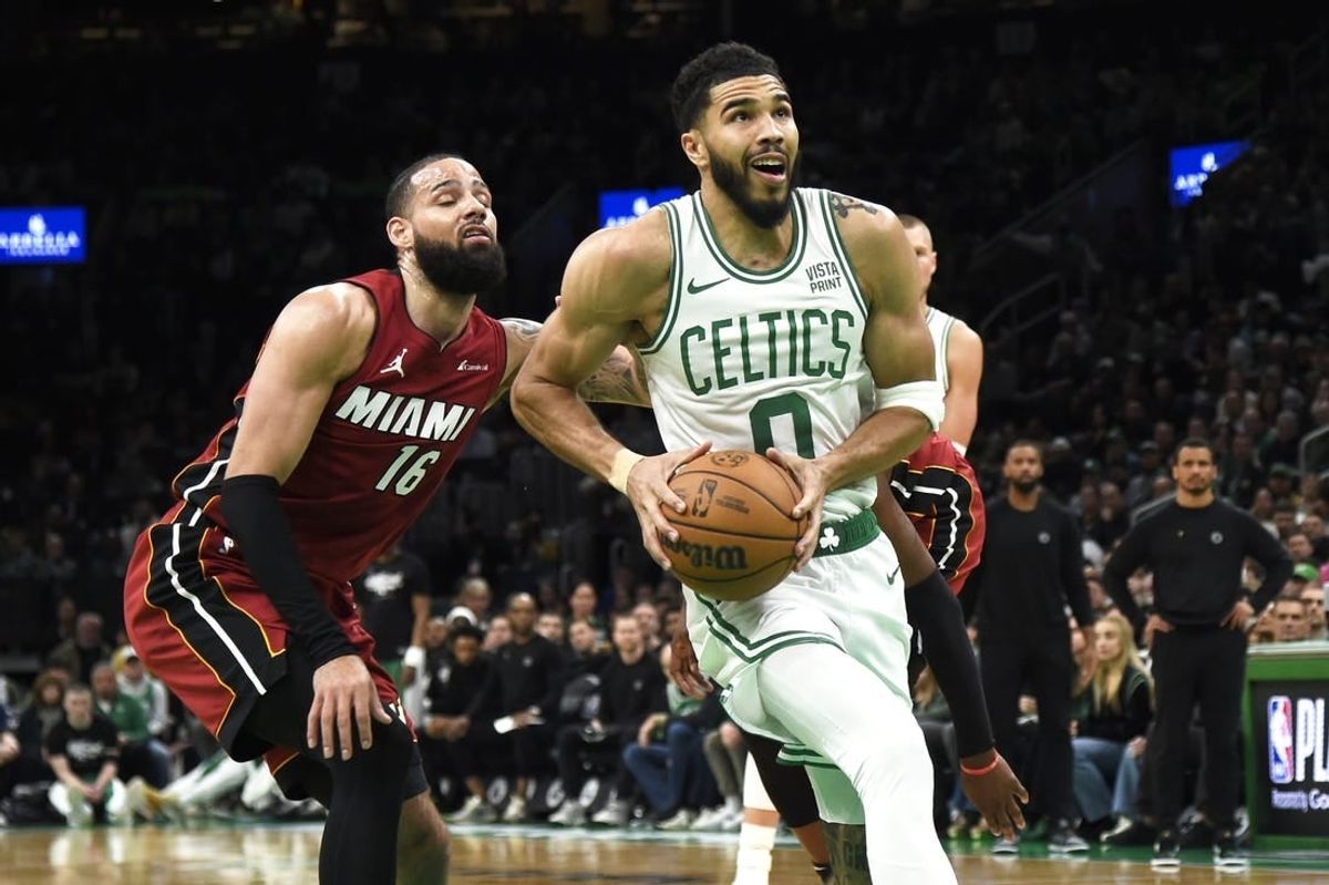 Apr 21, 2024; Boston, Massachusetts, USA; Boston Celtics forward Jayson Tatum (0) drives to the basket past Miami Heat forward Caleb Martin (16) during the second half in game one of the first round for the 2024 NBA playoffs at TD Garden.