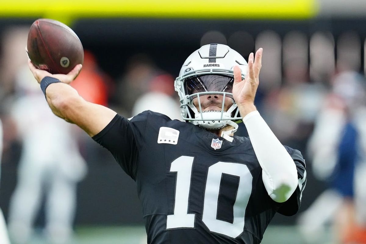 Jan 7, 2024; Paradise, Nevada, USA; Las Vegas Raiders quarterback Jimmy Garoppolo (10) warms up before a game against the Denver Broncos at Allegiant Stadium.