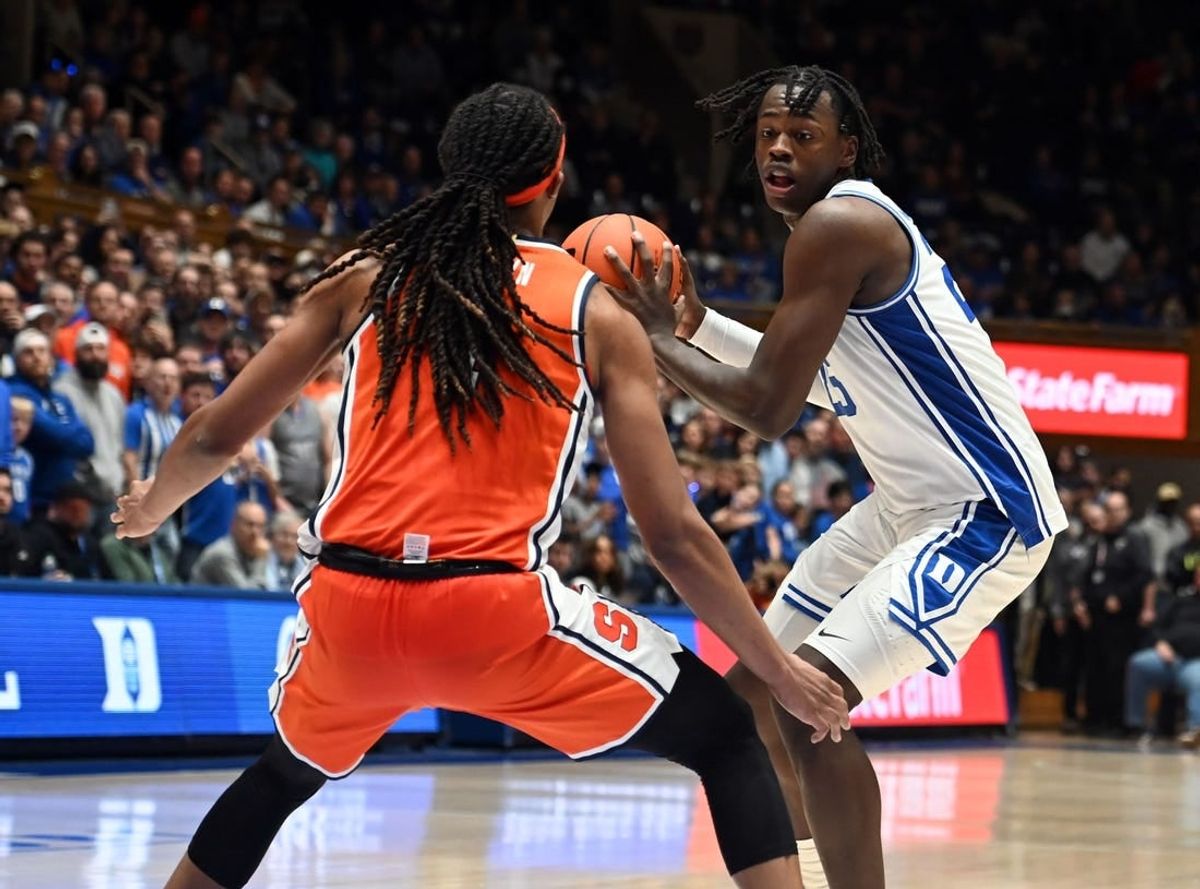 Jan 2, 2024; Durham, North Carolina, USA;  Duke Blue Devils forward Mark Mitchell (25) controls the ball in front of Syracuse Orange forward Maliq Brown (1) during the second half at Cameron Indoor Stadium.  The Blue Devils won 86-66.