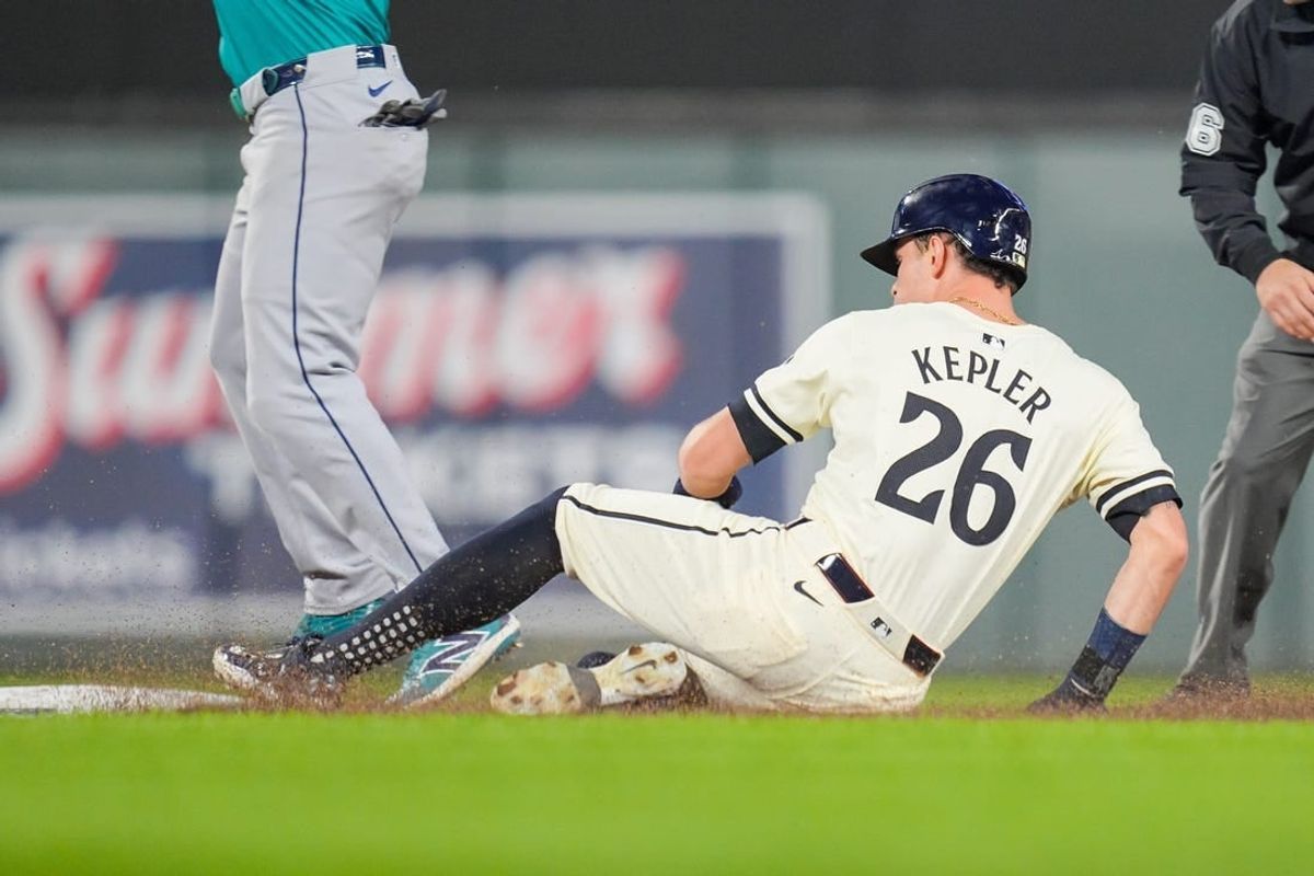 May 6, 2024; Minneapolis, Minnesota, USA; Minnesota Twins outfielder Max Kepler (26) slides into second against the Seattle Mariners in the eighth inning at Target Field.