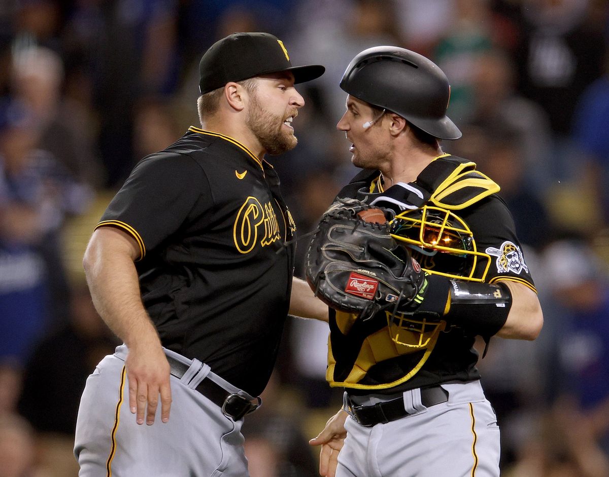 LOS ANGELES, CALIFORNIA - MAY 30: David Bednar #51 of the Pittsburgh Pirates celebrates a save with Michael Perez #5 and a 6-5 win over the Los Angeles Dodgers during the ninth inning at Dodger Stadium on May 30, 2022 in Los Angeles, California. (Photo by Harry How/Getty Images)