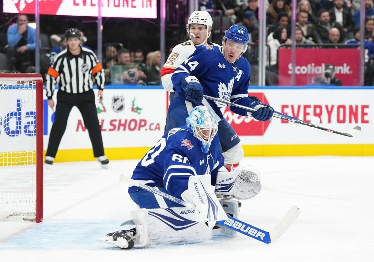 Nov 28, 2023; Toronto, Ontario, CAN; Florida Panthers left wing Matthew Tkachuk (19) battle in front of the net with Toronto Maple Leafs defenseman Morgan Rielly (44) during the second period at Scotiabank Arena.