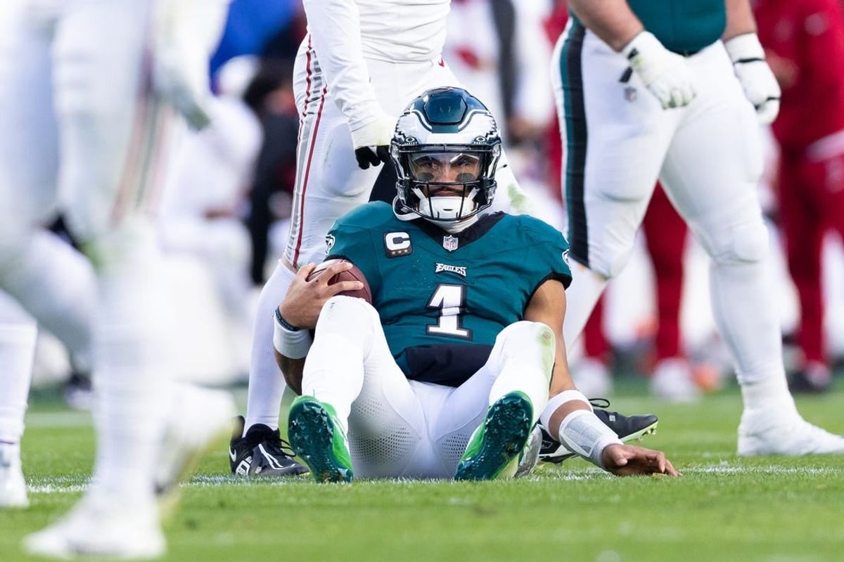 Dec 31, 2023; Philadelphia, Pennsylvania, USA; Philadelphia Eagles quarterback Jalen Hurts (1) sits on the field after being tackled during the fourth quarter against the Arizona Cardinals at Lincoln Financial Field.