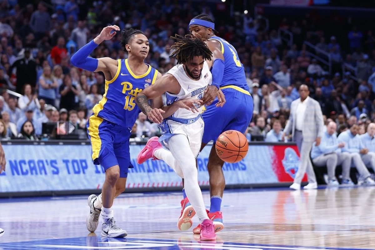 Mar 15, 2024; Washington, D.C., USA; North Carolina Tar Heels guard RJ Davis (4) looses control of the ball as Pittsburgh Panthers guard Jaland Lowe (15) and Panthers forward Blake Hinson (2) defend during the first half at Capital One Arena.