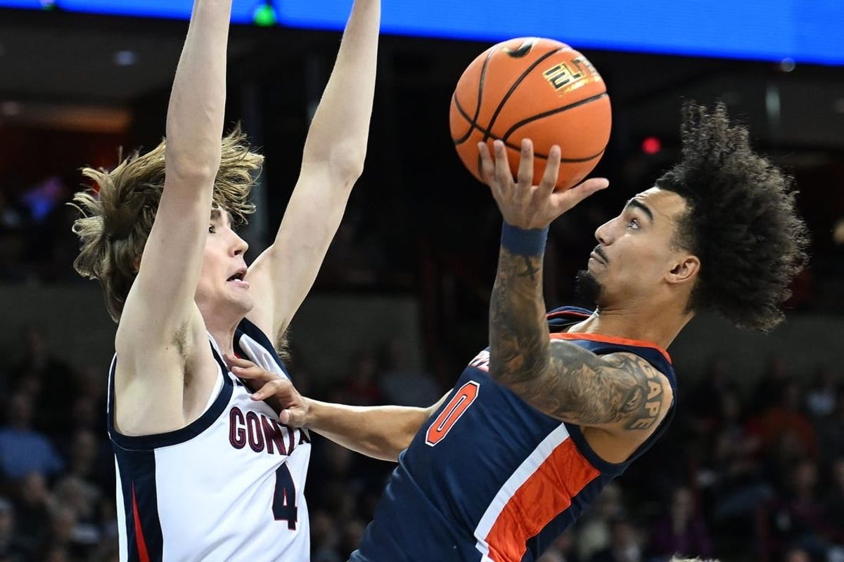 Jan 4, 2024; Spokane, Washington, USA; Pepperdine Waves guard Houston Mallette (0) shoots the ball against Gonzaga Bulldogs guard Dusty Stromer (4) in the first half at Spokane Arena.