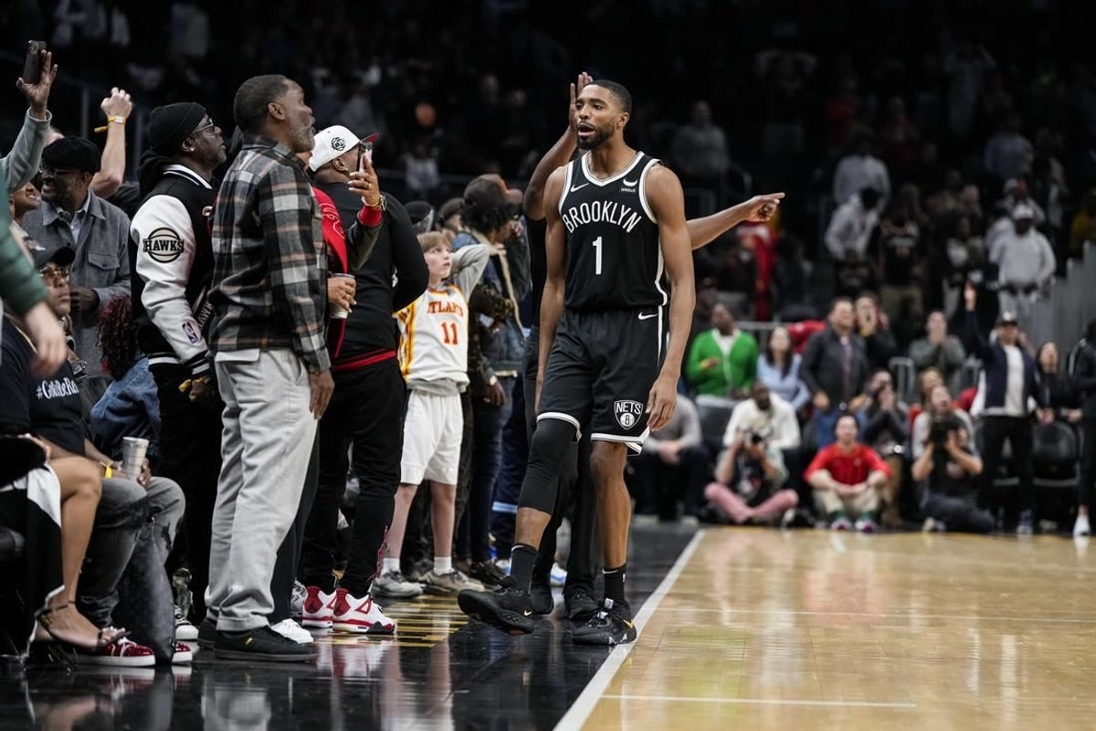 Dec 6, 2023; Atlanta, Georgia, USA; Brooklyn Nets forward Mikal Bridges (1) reacts with the fans after making the eventual game winning basket against the Atlanta Hawks in the final minute during the second half at State Farm Arena.
