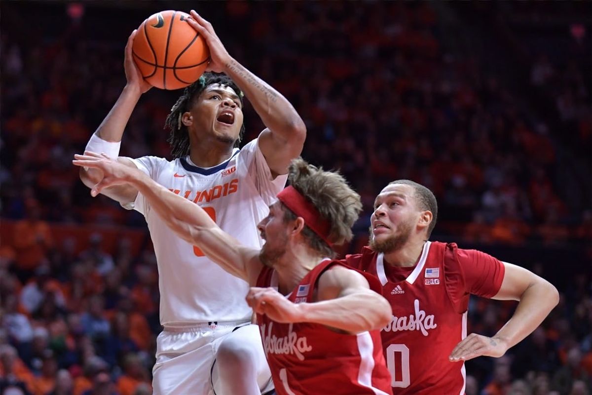 Feb 4, 2024; Champaign, Illinois, USA;  Illinois Fighting Illini guard Terrence Shannon Jr. (0) drives to the basket against Nebraska Cornhuskers guard Sam Hoiberg (1) during the first half at State Farm Center.
