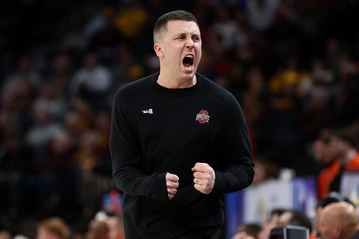 Mar 15, 2024; Minneapolis, MN, USA; Ohio State Buckeyes head coach Jake Diebler celebrates during the first half against the Illinois Fighting Illini at Target Center.