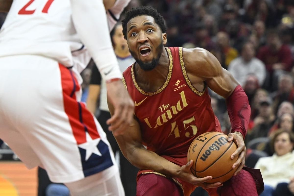 Jan 3, 2024; Cleveland, Ohio, USA; Cleveland Cavaliers guard Donovan Mitchell (45) drives to the basket in the second quarter against the Washington Wizards at Rocket Mortgage FieldHouse.