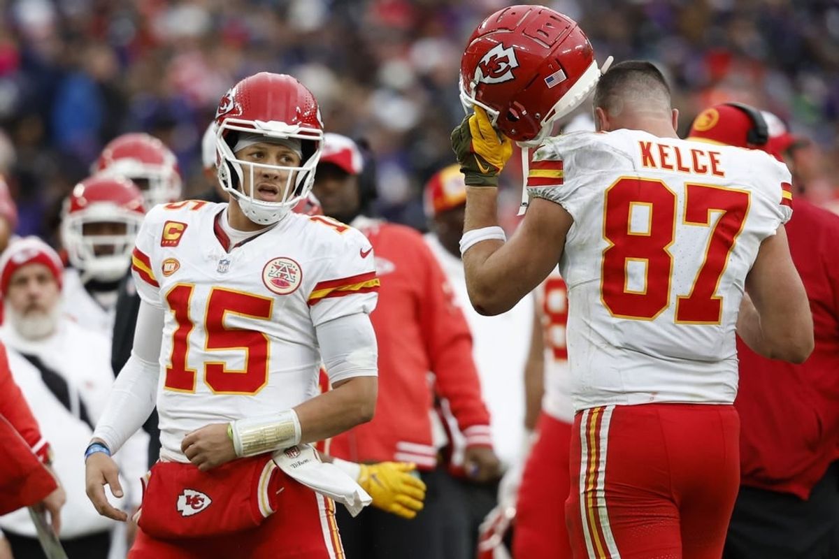 Jan 28, 2024; Baltimore, Maryland, USA; Kansas City Chiefs quarterback Patrick Mahomes (15) celebrates with Chiefs tight end Travis Kelce (87) after a touchdown against the Baltimore Ravens in the AFC Championship football game at M&T Bank Stadium.