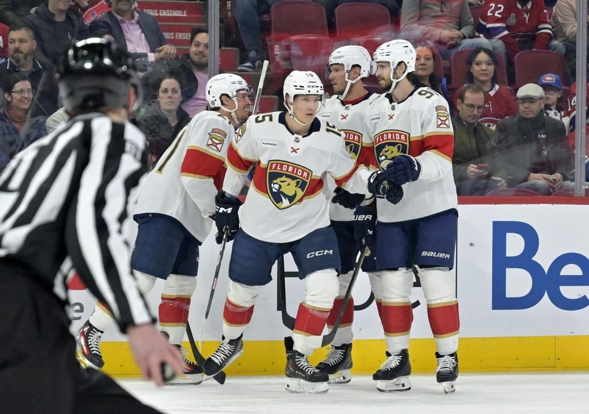 Apr 2, 2024; Montreal, Quebec, CAN; Florida Panthers forward Anton Lundell (15) celebrates with teammates after scoring a goal against the Montreal Canadiens during the first period at the Bell Centre.