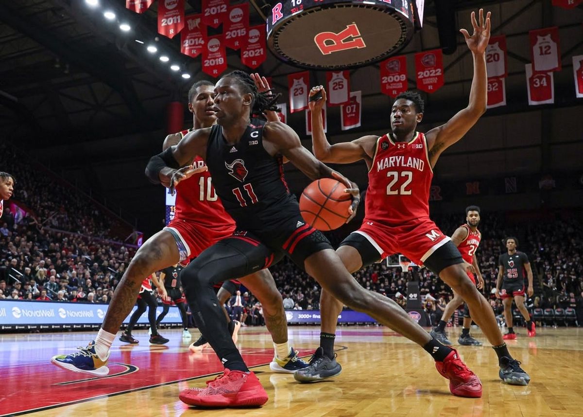 Feb 25, 2024; Piscataway, New Jersey, USA; Rutgers Scarlet Knights center Clifford Omoruyi (11) dribbles in front of Maryland Terrapins forward Julian Reese (10) and forward Jordan Geronimo (22) during the second half at Jersey Mike's Arena.