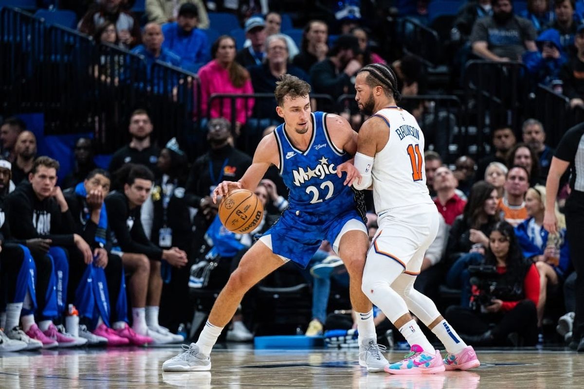 Feb 14, 2024; Orlando, Florida, USA; Orlando Magic forward Franz Wagner (22) dribbles the ball against New York Knicks guard Jalen Brunson (11) in the second quarter at KIA Center.