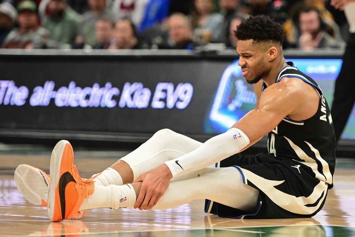 Apr 9, 2024; Milwaukee, Wisconsin, USA; Milwaukee Bucks forward Giannis Antetokounmpo (34) grabs his leg in the third quarter and left game against the Boston Celtics with an injury at Fiserv Forum.