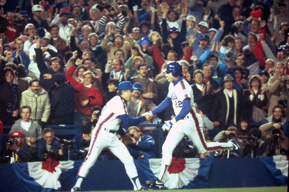 Mets Ray Knight is congratulated by third base coach Bud Harrelson after his 7th inning home run off Boston's Calvin Schiraldi broke a 3-3 tie during Game 7 of the World Series at Shea Stadium Oct. 27, 1986.

Mets Vs Red Sox 1986 World Series