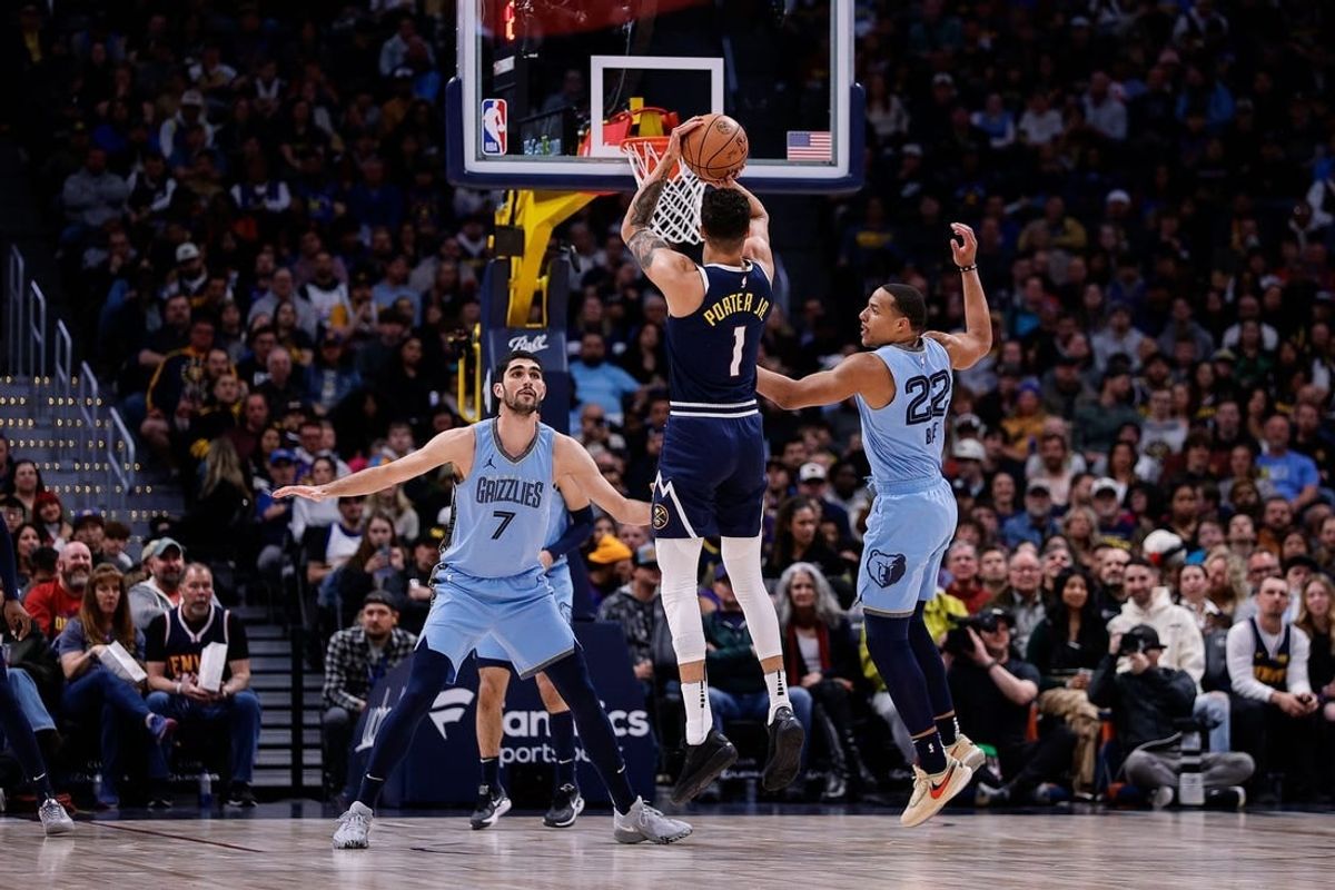 Mar 25, 2024; Denver, Colorado, USA; Denver Nuggets forward Michael Porter Jr. (1) attempts a three point shot against Memphis Grizzlies guard Desmond Bane (22) and forward Santi Aldama (7) in the first quarter at Ball Arena.