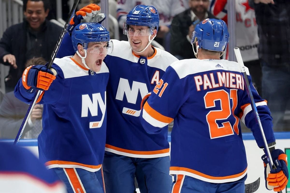 Dec 19, 2023; Elmont, New York, USA; New York Islanders center Bo Horvat (14) celebrates his goal against the Edmonton Oilers with center Brock Nelson (29) and center Kyle Palmieri (21) during the second period at UBS Arena.