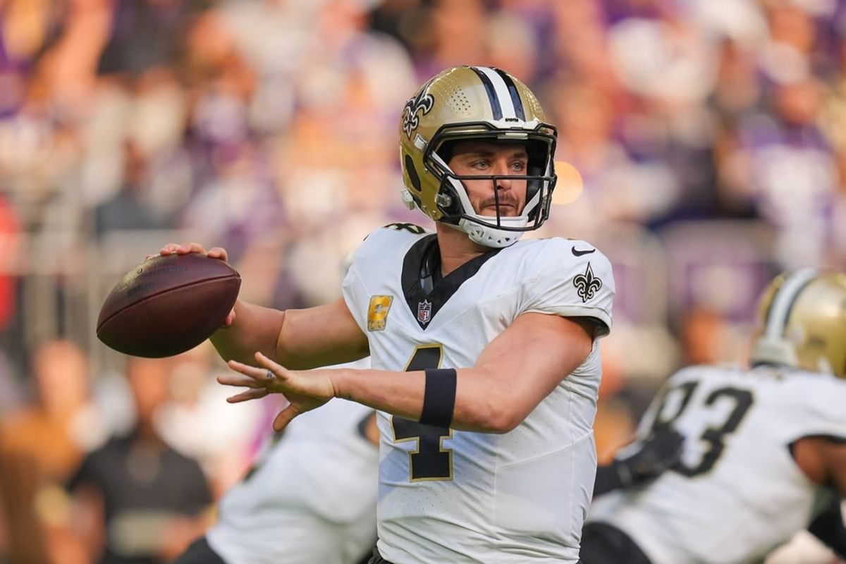 Nov 12, 2023; Minneapolis, Minnesota, USA; New Orleans Saints quarterback Derek Carr (4) passes against the Minnesota Vikings in the first quarter at U.S. Bank Stadium.