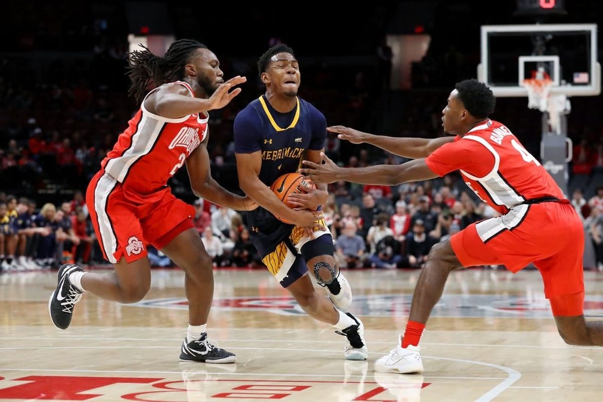 Nov 15, 2023; Columbus, Ohio, USA;  Merrimack College Warriors guard Jaylen Stinson (1) dribbles into the lane as Ohio State Buckeyes guard Bruce Thornton (left) and guard Dale Bonner (4) defend on the play at Value City Arena.