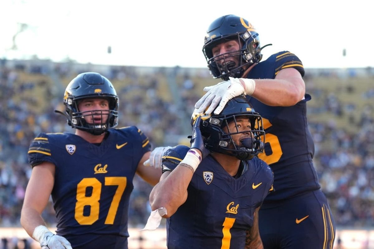 Nov 11, 2023; Berkeley, California, USA; California Golden Bears running back Jaydn Ott (1) gestures towards the Washington State Cougars fan section after scoring a touchdown while being congratulated by tight end Jeffrey Johnson (right) and tight end Jack Endries (87) during the fourth quarter at California Memorial Stadium.