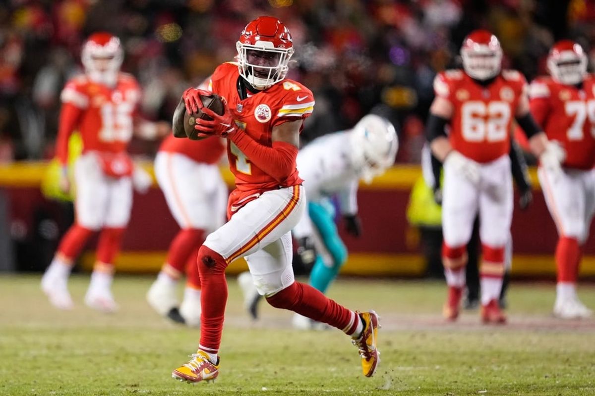 Jan 13, 2024; Kansas City, Missouri, USA; Kansas City Chiefs wide receiver Rashee Rice (4) runs the ball against the Miami Dolphins during the second half of the 2024 AFC wild card game at GEHA Field at Arrowhead Stadium.