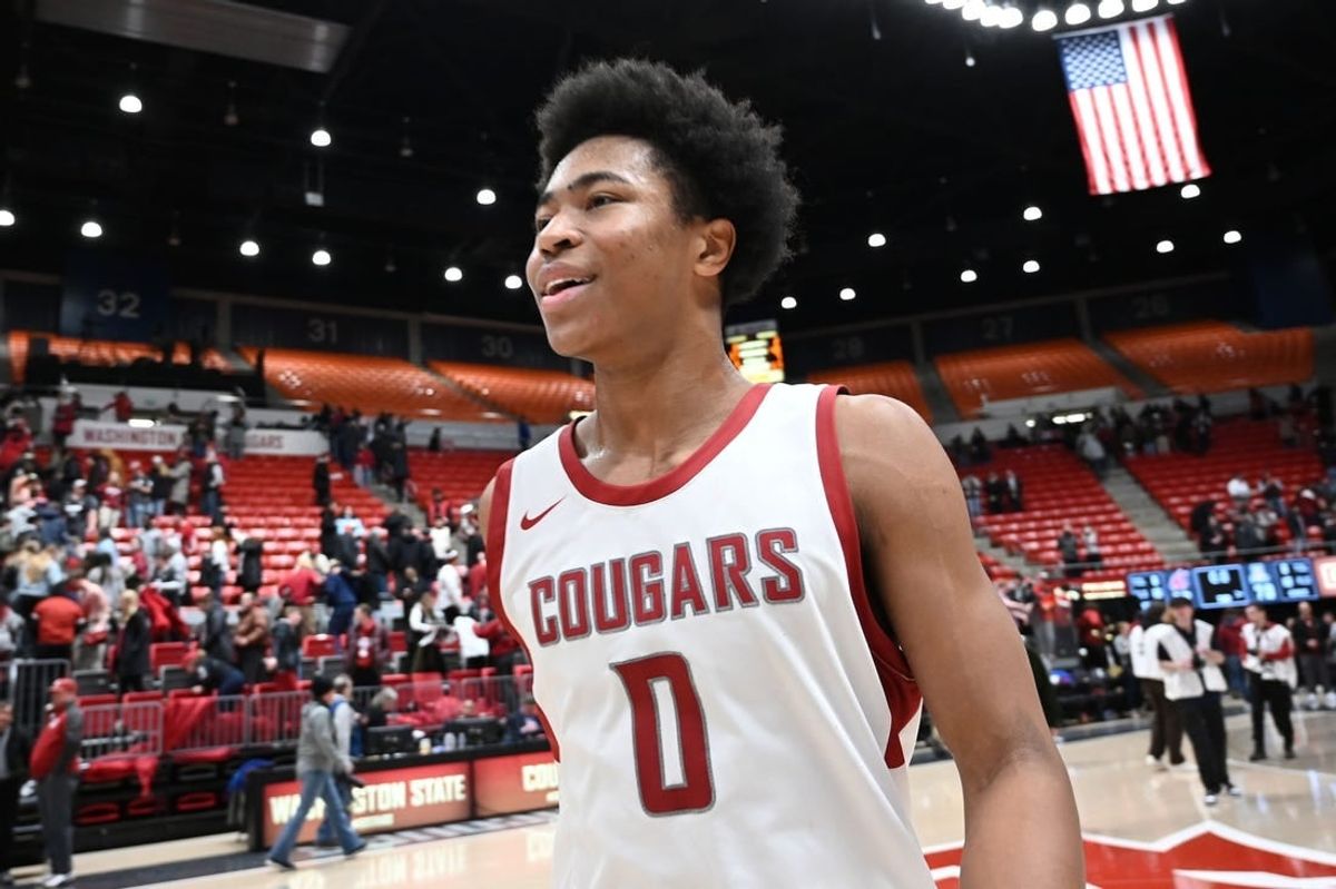 Jan 13, 2024; Pullman, Washington, USA; Washington State Cougars forward Jaylen Wells (0) celebrates after a game against the Arizona Wildcats at Friel Court at Beasley Coliseum.