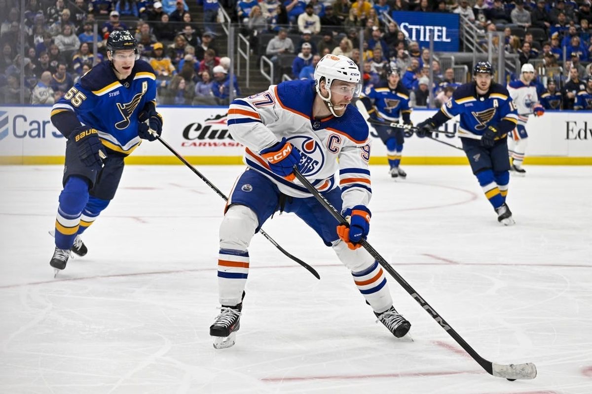 Feb 15, 2024; St. Louis, Missouri, USA;  Edmonton Oilers center Connor McDavid (97) controls the puck against the St. Louis Blues during the third period at Enterprise Center.