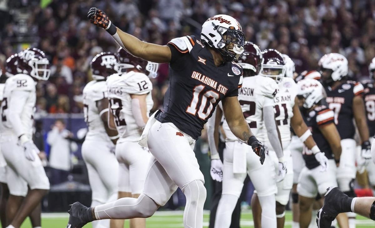 Dec 27, 2023; Houston, TX, USA; Oklahoma State Cowboys wide receiver Rashod Owens (10) celebrates after scoring a touchdown during the first quarter against the Texas A&M Aggies at NRG Stadium.
