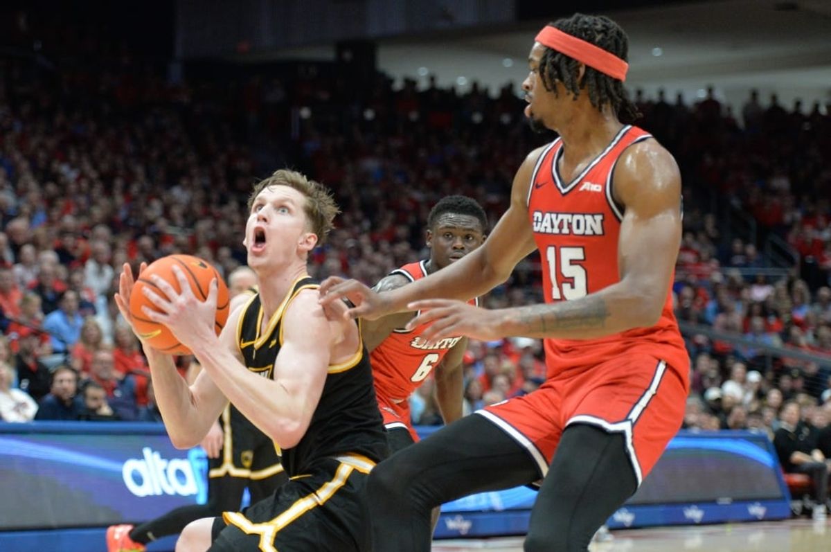 Mar 8, 2024; Dayton, Ohio, USA; Virginia Commonwealth Rams guard Sean Bairstow (7) shoots the ball against Dayton Flyers forward DaRon Holmes II (15) during the first half of the game at University of Dayton Arena.