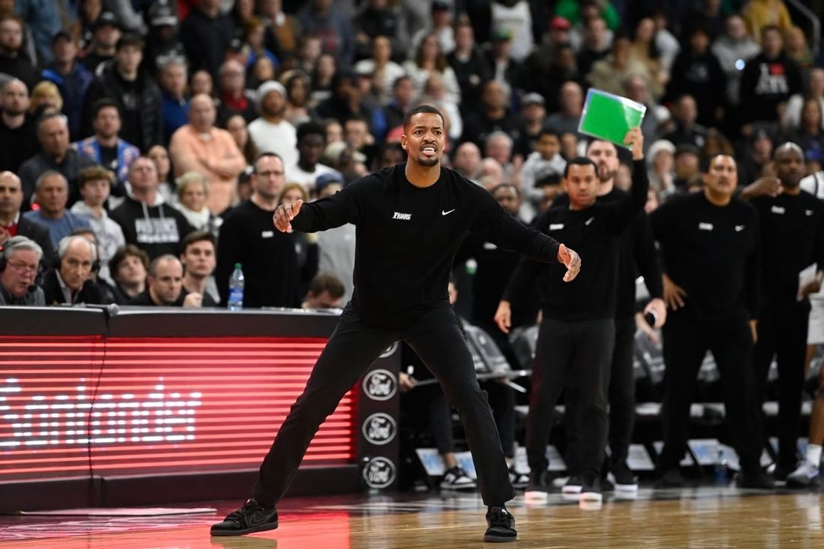 Dec 23, 2023; Providence, Rhode Island, USA; Providence Friars head coach Kim English watches game action against the Butler Bulldogs during the second half at Amica Mutual Pavilion.