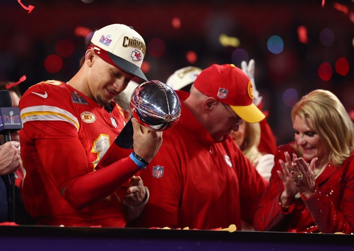 Feb 11, 2024; Paradise, Nevada, USA; Kansas City Chiefs quarterback Patrick Mahomes (15) celebrates with the Vince Lombardi Trophy after defeating the San Francisco 49ers in Super Bowl LVIII at Allegiant Stadium.